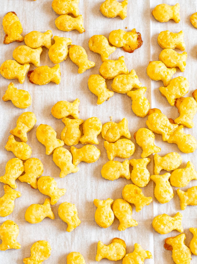 Crispy goldfish crackers on a sheet pan.